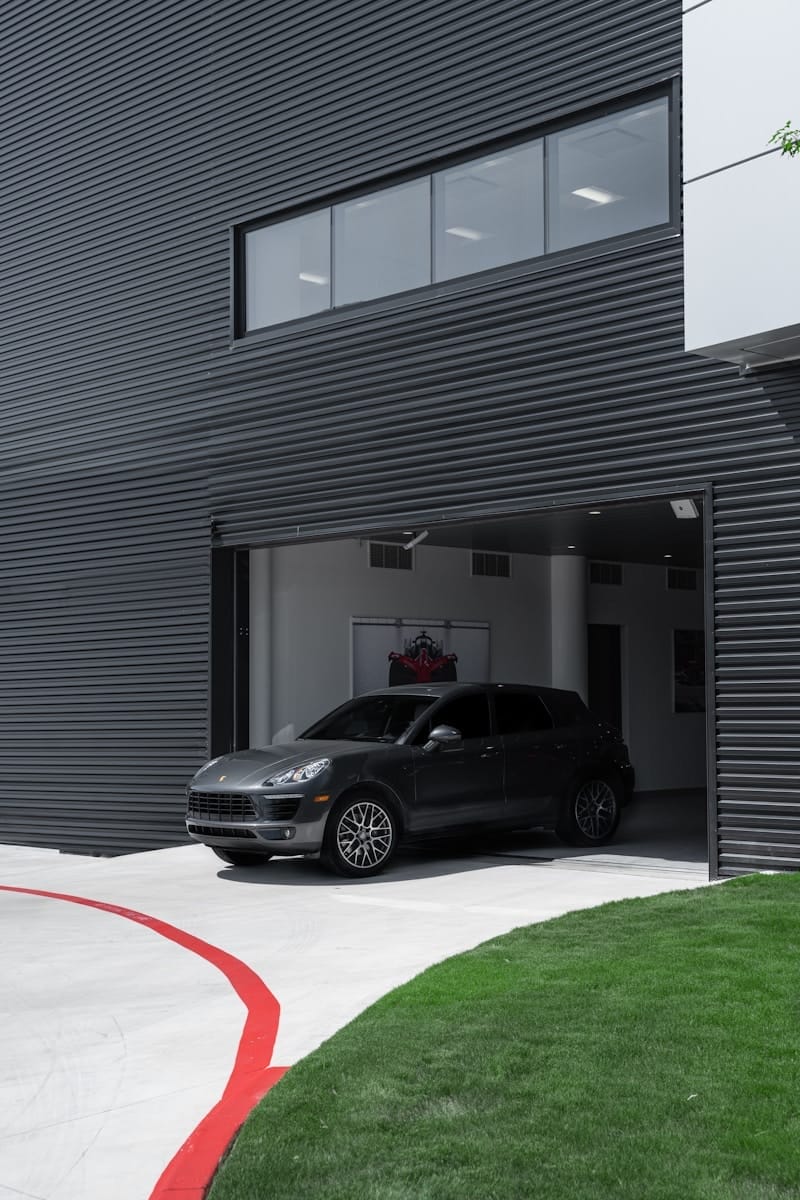 black suv parked in front of garage